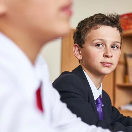 Two young people in school classroom