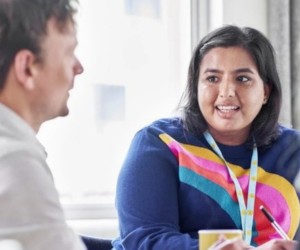 A counsellor talking to two adults