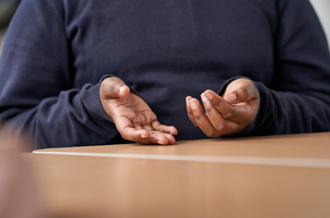 Child's hands gesturing during a conversation