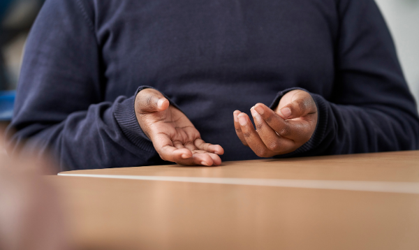 Child's hands gesturing during a conversation