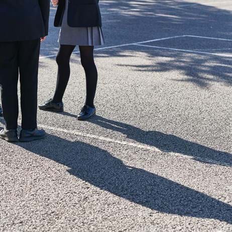 Students standing in a playground