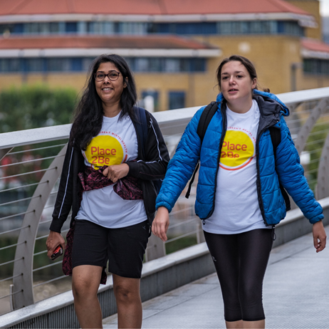 Two ladies walking in support of Place2Be