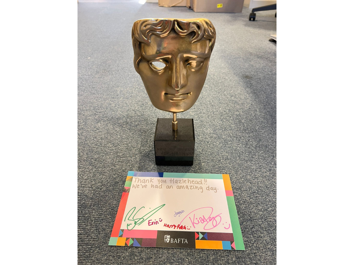 A BAFTA mask with signed autographs from guests addressed to Hazlehead primary