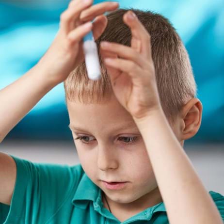boy holding pencil
