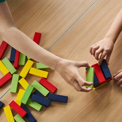 Children's hands with colourful building blocks